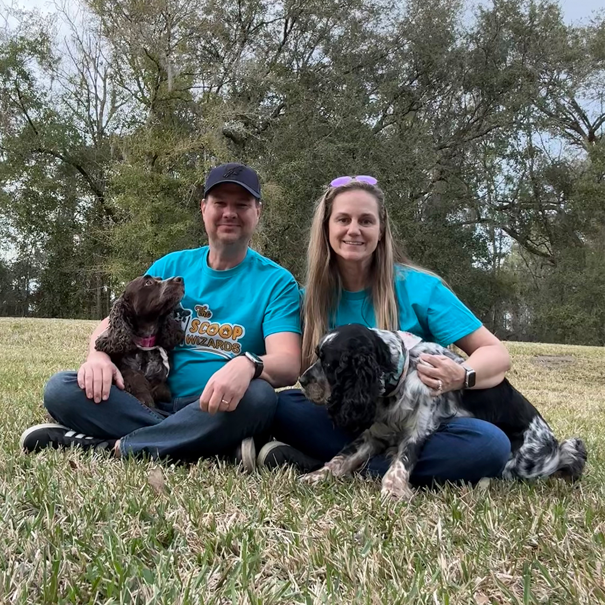 Professional dog waste removal team from The Scoop Wizards with their dogs in Northeast Florida